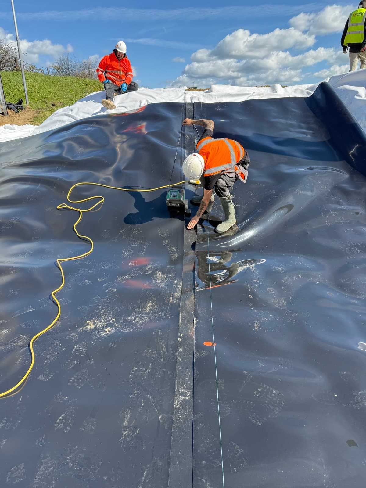Two Aquatech operatives welding the containment membrane at the Bognor Regis AD plant